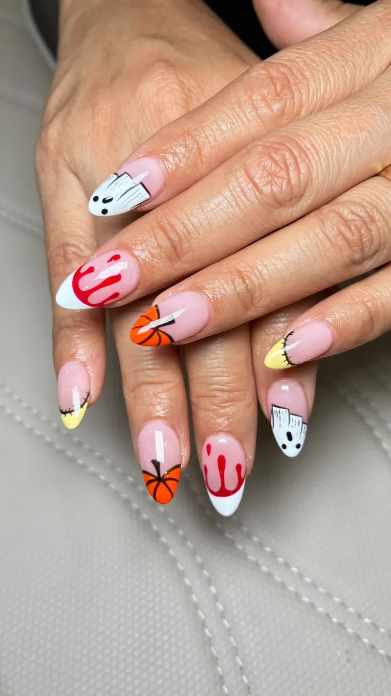 Almond nails with hand-painted French tips and playful seasonal art
