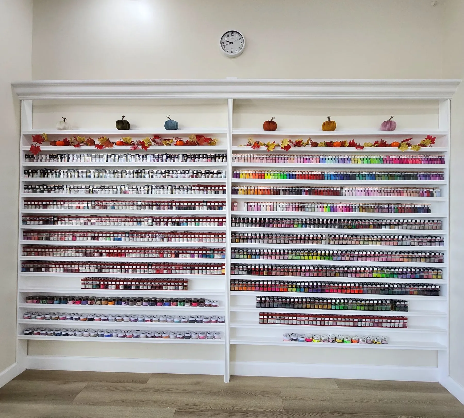 Wall of hundreds of gel polish and dip powder colors