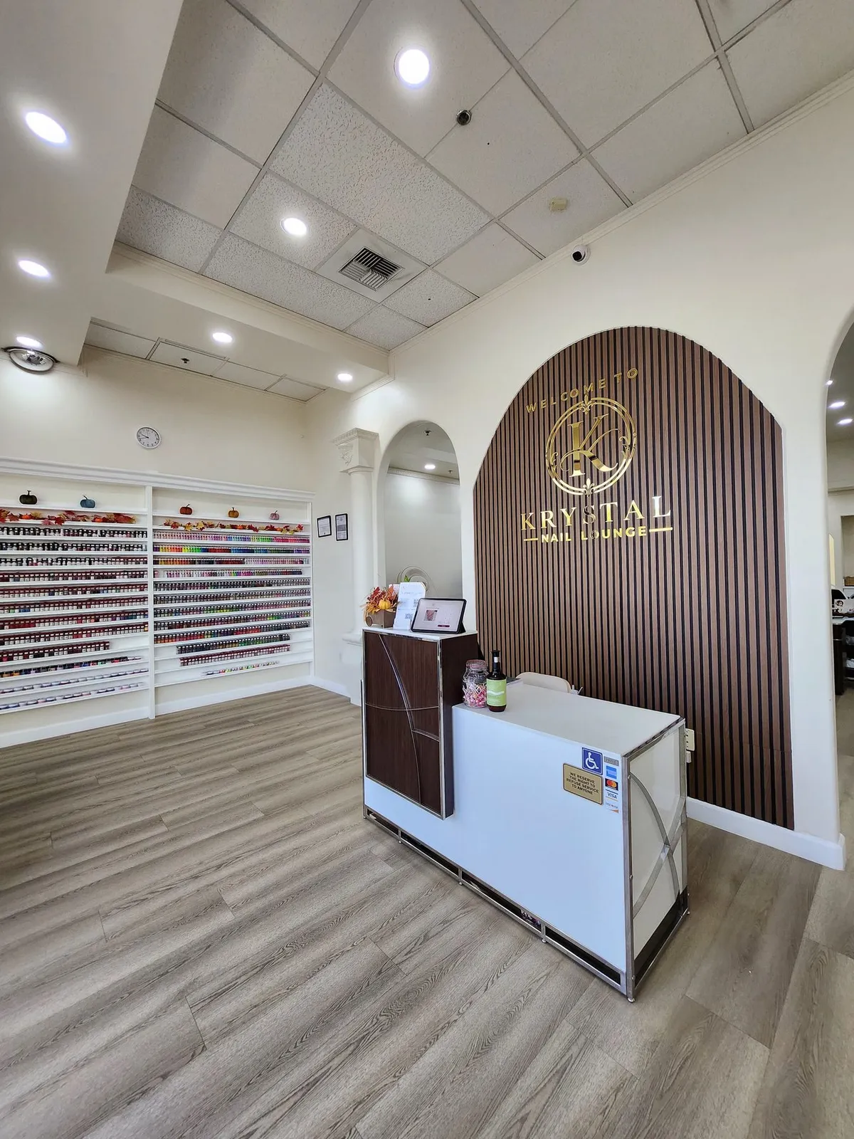 Front desk with the color wall and arched doorways